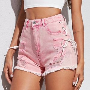 SHEIN Pink Lace Up Side Hem Ripped Denim Shorts